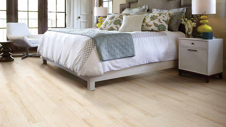 wood look laminate flooring in a bright bedroom