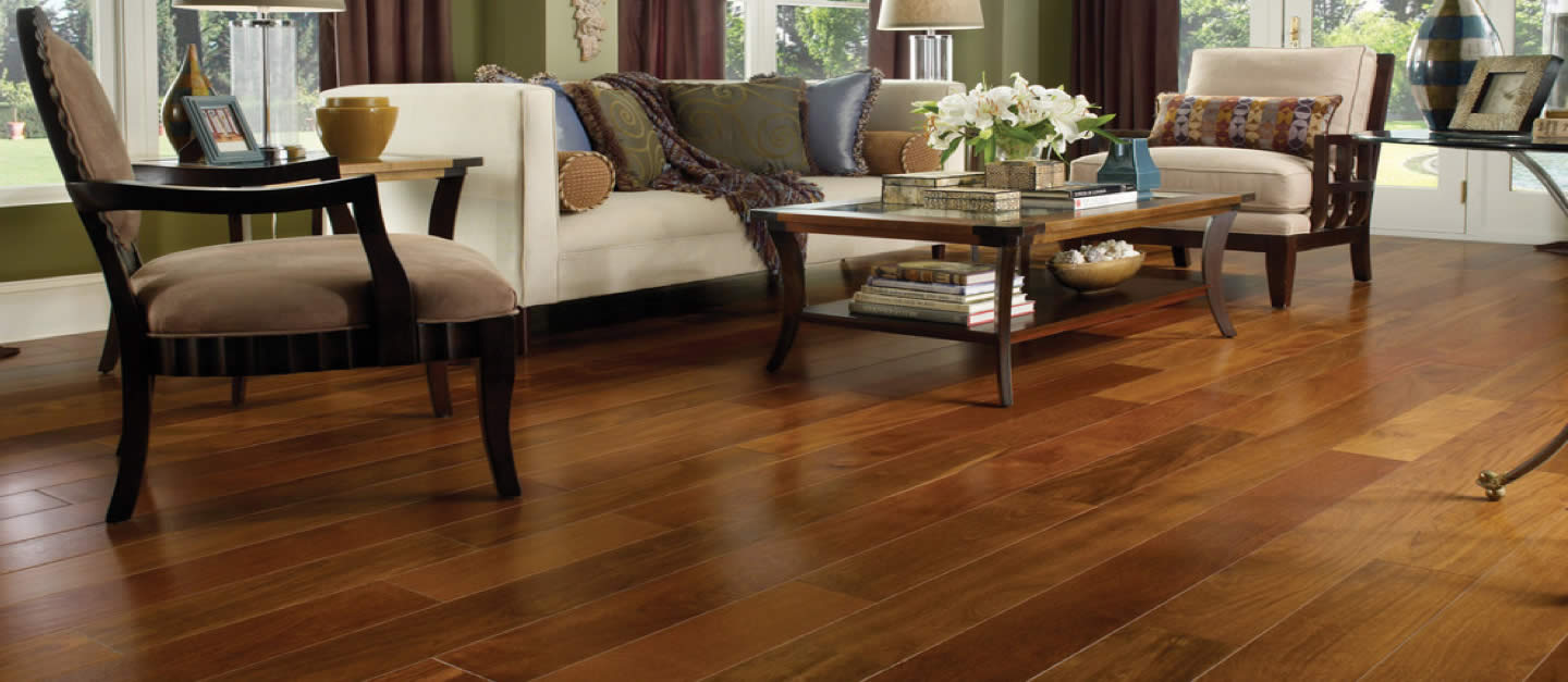 Laminate wood-look floor in a living room setting featuring coffee table and chairs.